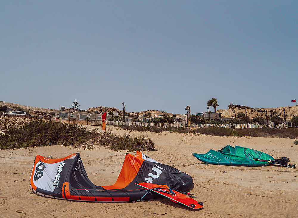 Kiteboarding equipment on Dakhla beach - NewSpiritDakhla kites ready for water sports adventure