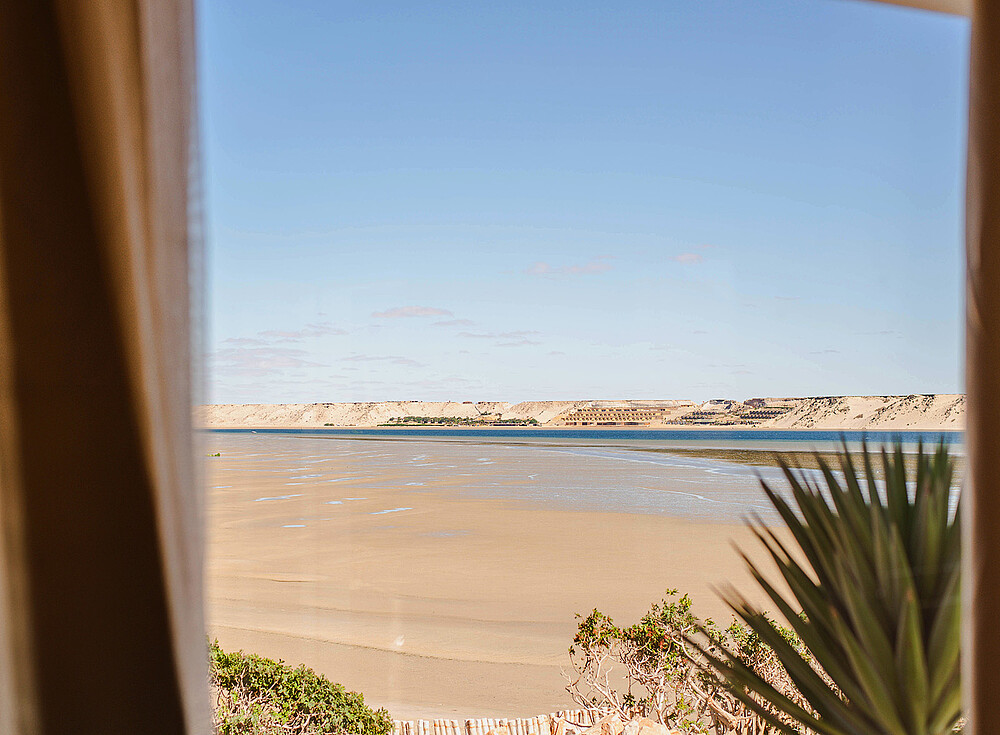 NewSpiritDakhla Bungalow Premium ocean view - Dakhla kiteboarding beach with turquoise water and palm trees perfect for water sports