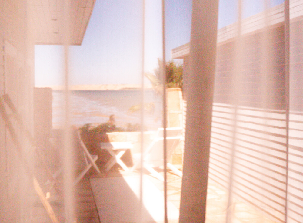 NewSpiritDakhla Bungalow Deluxe - Luxury kiteboarding accommodation with ocean view balcony table, Dakhla kitesurfing destination