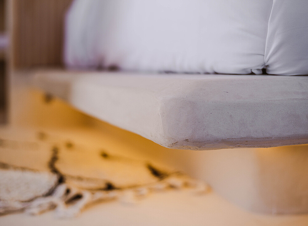 NewSpiritDakhla Premium Bungalow bed with white pillows - comfortable kitesurfing accommodation in Dakhla