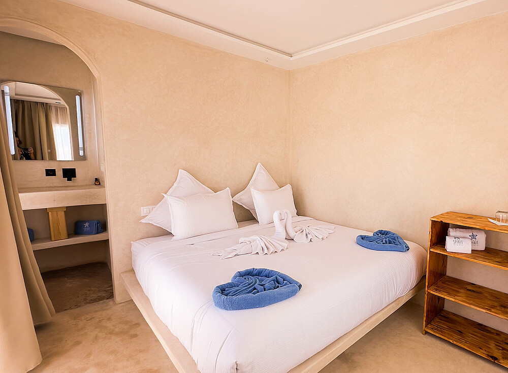NewSpiritDakhla Bungalow Deluxe bedroom with double bed, kiteboarding accommodation Dakhla Morocco