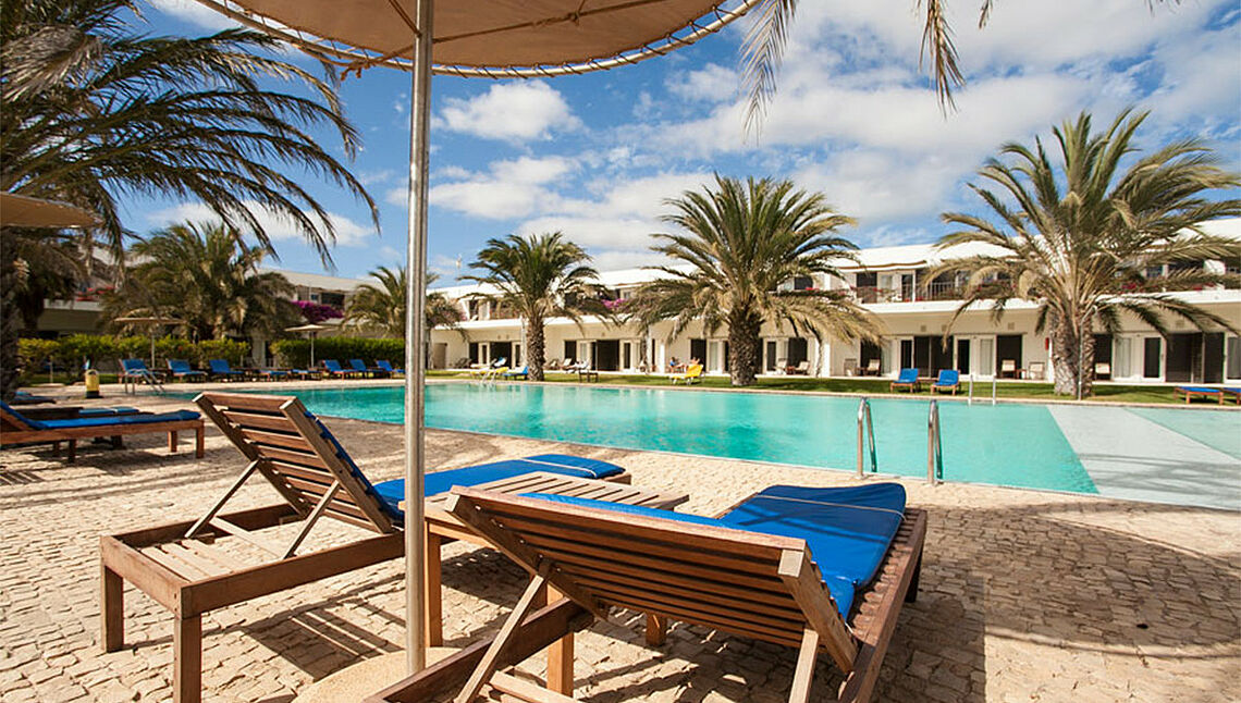 Luxury pool area with sun loungers at KBC Kitesurf Center Sal - perfect relaxation spot after kiteboarding sessions