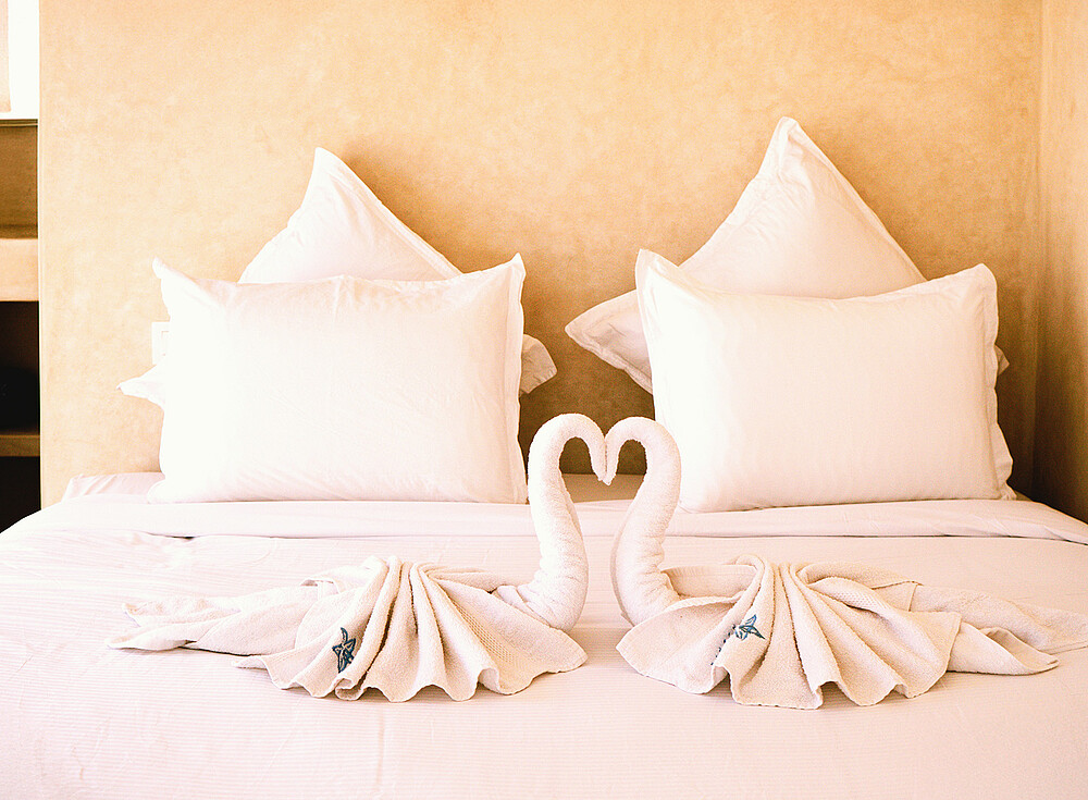 NewSpiritDakhla Bungalow Deluxe hotel room with swan towel art - kiteboarding accommodation Dakhla Morocco