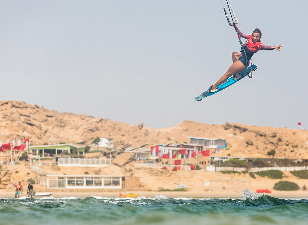NewSpiritDakhla kitesurfing jump over ocean waves at Dakhla beach - kiteboarding water sports travel destination