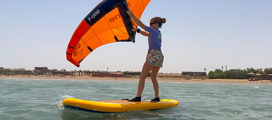Wingfoilschool Kids lesson on yellow board at KBC Kitesurf & Wingfoil Center El Gouna - kiteboarding water sports