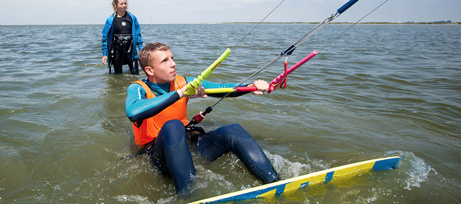 Kitesurfing lesson with instructor at KBC Kitesurf Center Hindeloopen - water sports training on Dutch beach