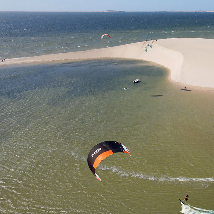 Kitesurfing at KBC New Spirit Kitesurf Center Dakhla: Lagoon Trip at White Dune sandbar with kites over turquoise waters