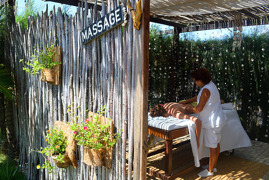 Outdoor massage therapy at KBC Kitesurf Center Parajuru - relaxation after kiteboarding sessions in Brazil