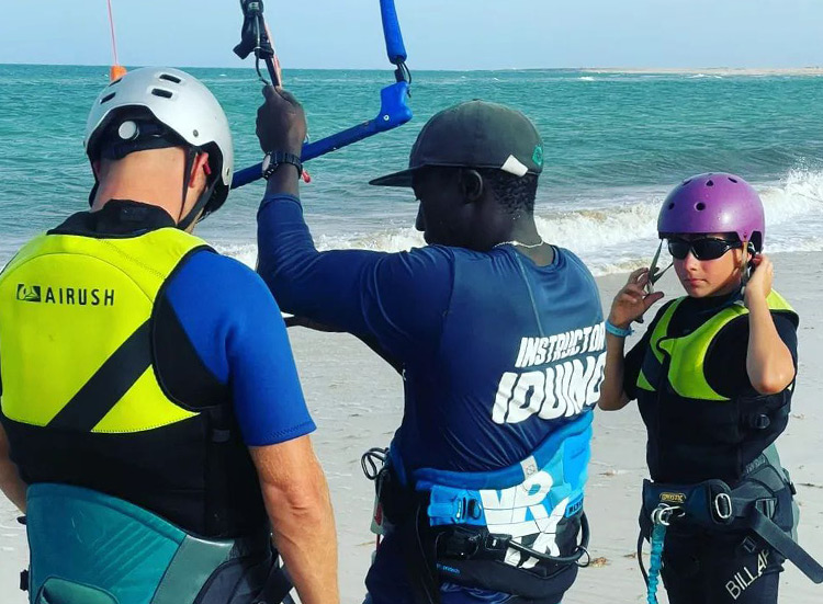 Kitesurf Event kiteboarding lesson at KBC Surf Hub Sal beach - instructor teaching students water sports equipment in Sal