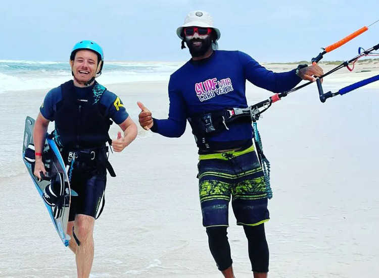 Kitesurf Event featuring two kitesurfers on beach at KBC Surf Hub Sal - kiteboarding lessons in Sal, Cape Verde