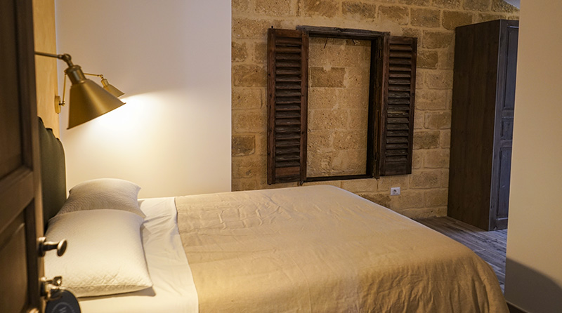 Vajarassa hotel room with stone wall - cozy accommodation for kiteboarding and water sports travelers