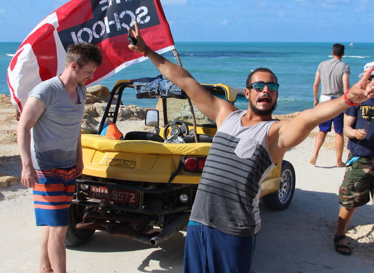 Buggy Tours kiteboarding beach adventure with yellow beach buggy, kitesurfer at turquoise ocean, water sports travel destination